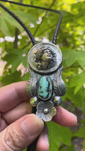 Load and play video in Gallery viewer, Bolo Tie with 1964 Silver Pop-Out Coin, Turquoise and Handmade Leaves &amp; Flower in Solid Sterling Silver

