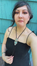 Load and play video in Gallery viewer, Bolo Tie with 1964 Silver Pop-Out Coin, Turquoise and Handmade Leaves &amp; Flower in Solid Sterling Silver
